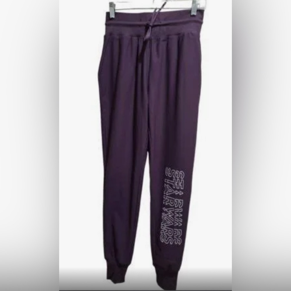 Star Wars joggers purple bought in Disneyland. Size small drawstring.
